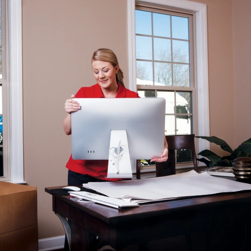 Woman packing computer