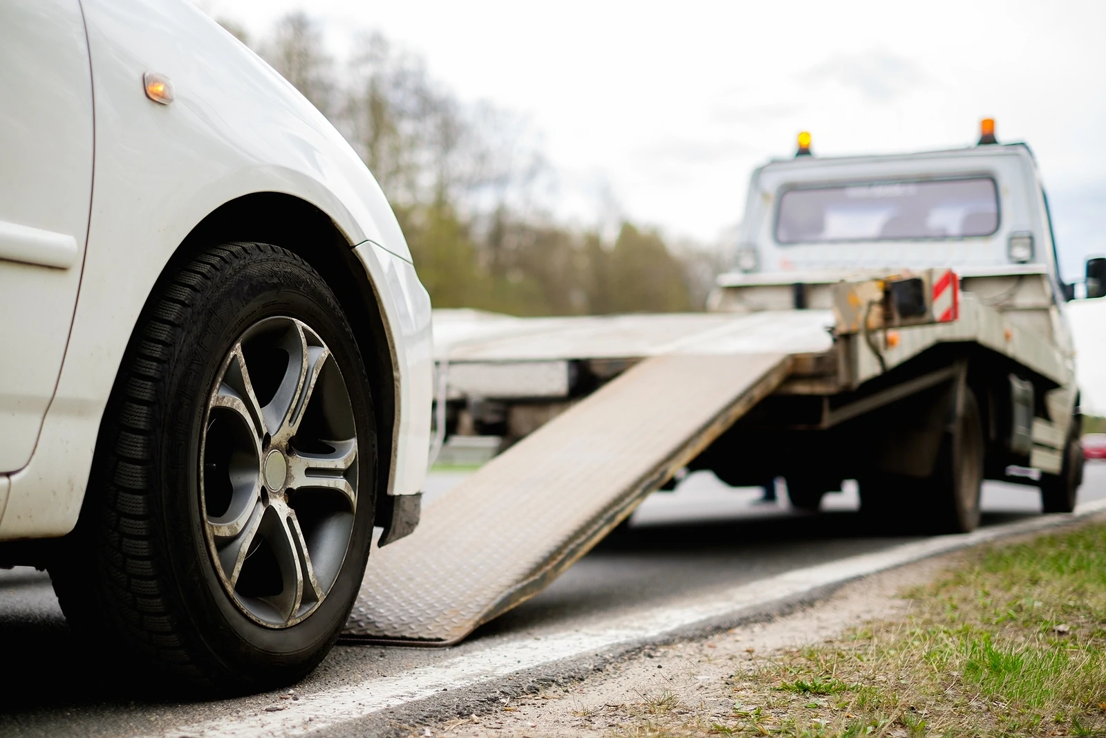 Loading car onto tow truck